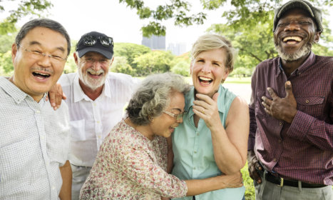 group of elderly smiling and laughing