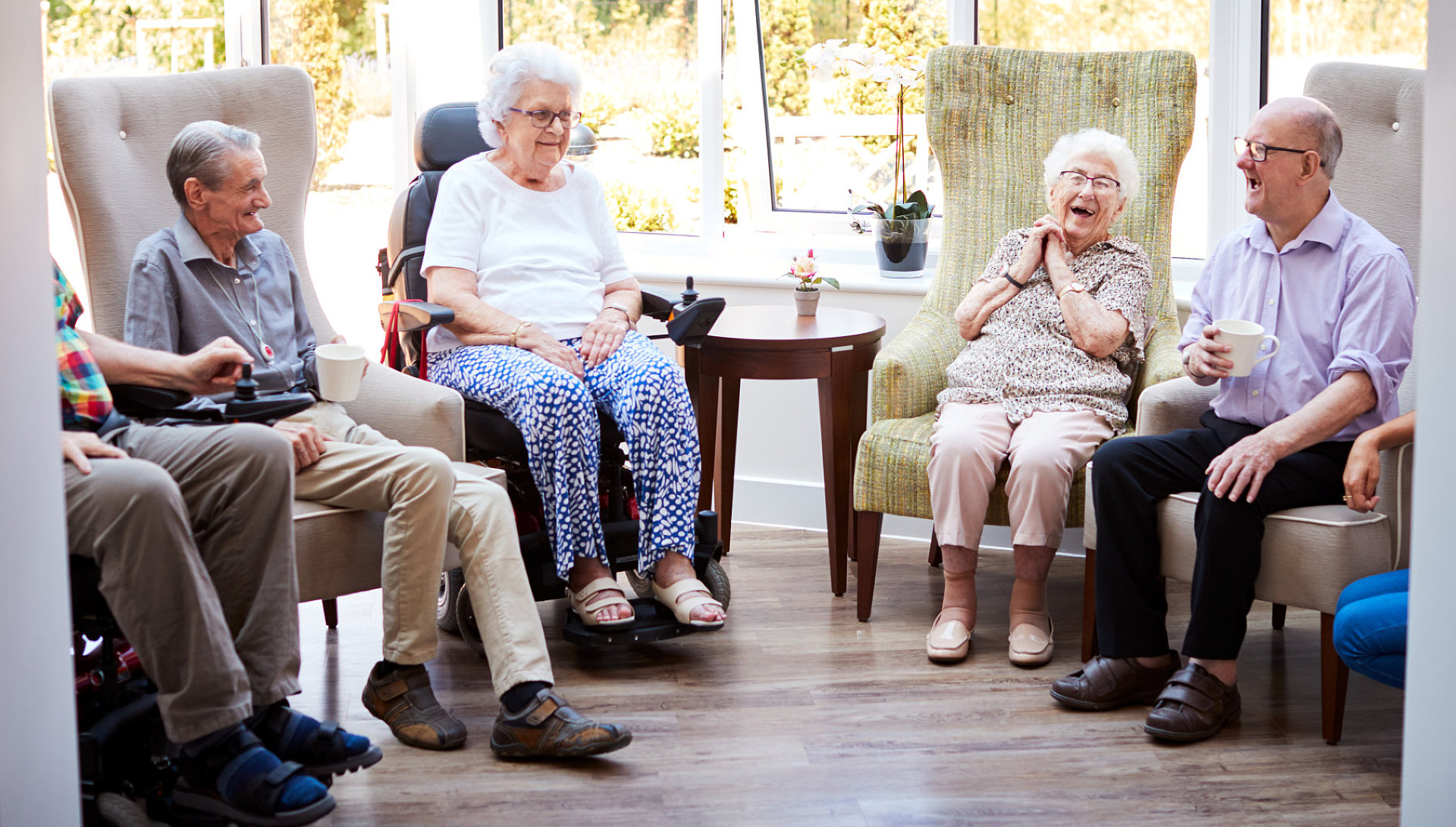 group of elderly smiling and laughing