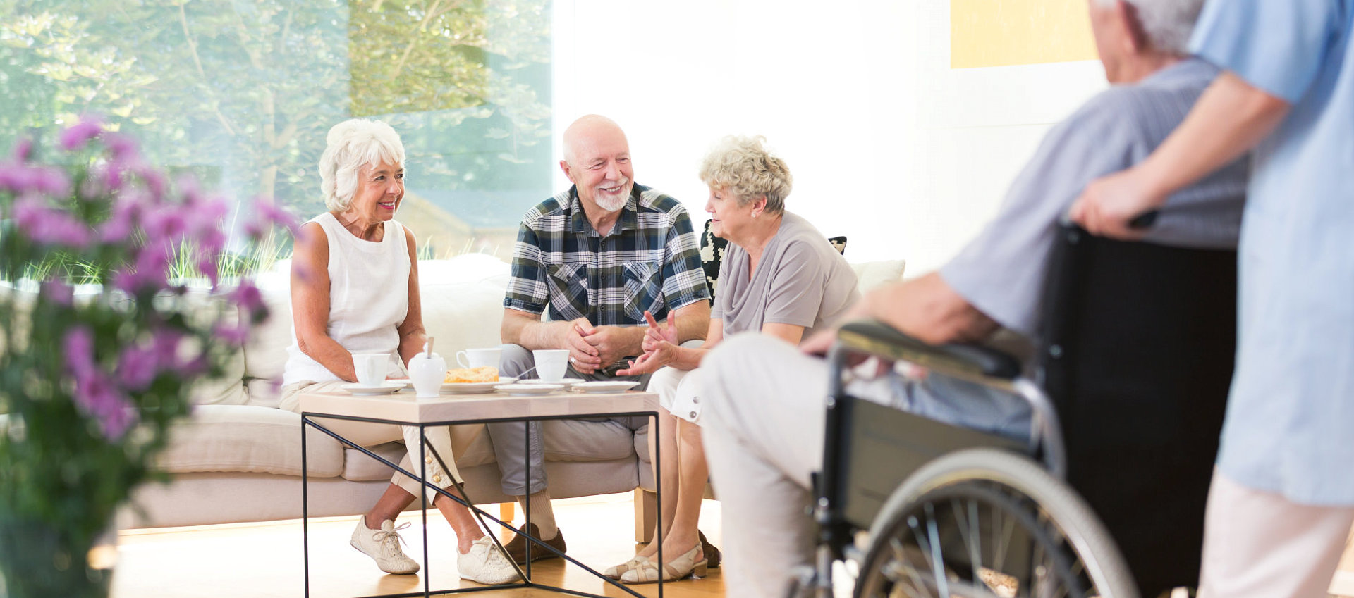 three elderly talking